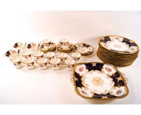 A Coalport part tea and dinner service comprising: eleven plates, 23.5cm diameter, two sandwich plates, 27cm wide, three teac