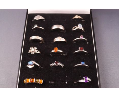 A collection of sixteen sterling silver dress rings consisting of signet and gemset designs. Gross weight 42.0 grams. Ranging