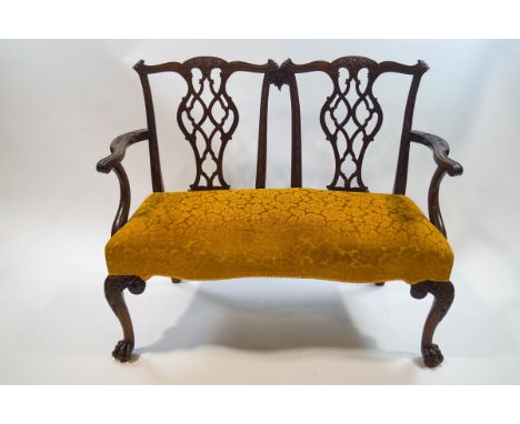 An Edwardian mahogany double sofa, the backs with Chippendale style splats, scroll arms, cabriole legs and lion's paw feet, m