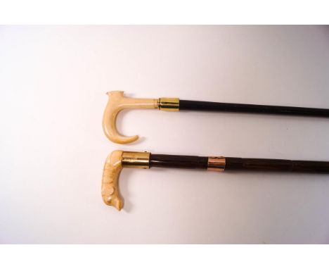 A malacca walking stick with early 20th century ivory knop of a dog and gold collar, stamped 375, and a further walking stick