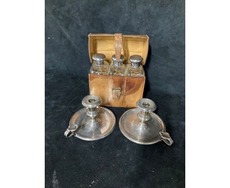 Set of three Glass flasks with Silver Hallmarked lids in a tan leather case and two Silver Candle stick holders - approximate