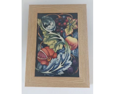A master Moorcroft ceramic framed plaque, limited to 50. Study in Fruits, with a cobalt blue back ground.inside frame measure