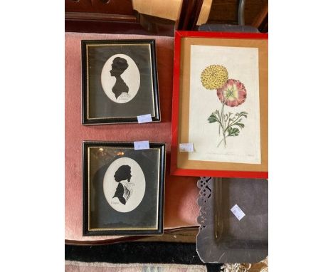 2 silhouettes of ladies faces, along with 1 print of flowers