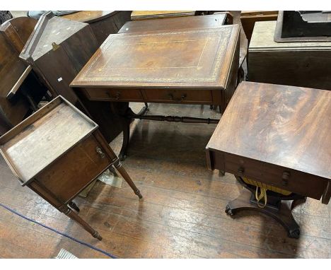 A twentieth century inlayed mahogany sofa table with folding ends and brown leather tops. 89cm long. on brass claw feet and c