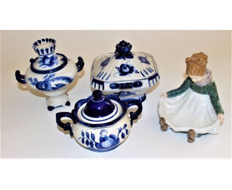 A Royal Copenhagen sitting Fanoe girl figure designed by Lotte Benter, printed mark Royal Copenhagen and number 1315, 13cm hi