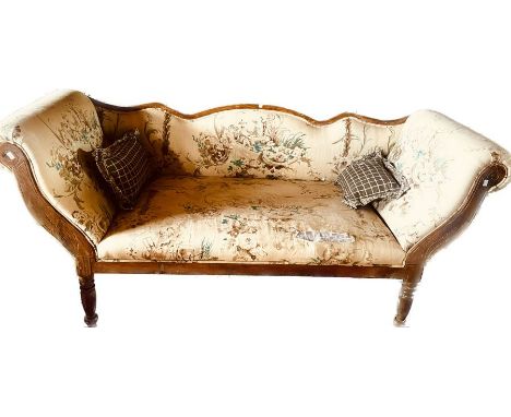 A Victorian revival pine frame upholstered sofa, serpentine back rest, scrolling arm rest, raised on turned tapered legs. 90c