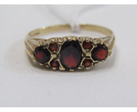 GARNET DRESS RING, 9ct yellow gold ring set 3 principal garnets with 4 further garnets, size R/S 