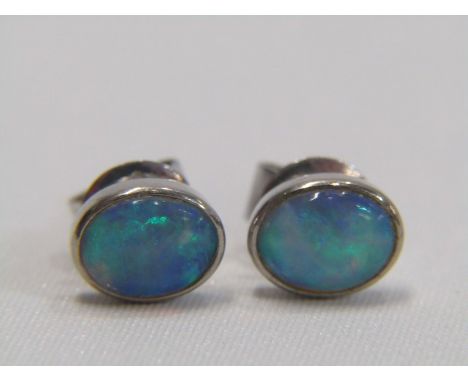 VINTAGE OVAL NATURAL OPAL STUD EARRINGS, set in 14ct rub over settings, with butterfly back, full spectrum of colour, beautif