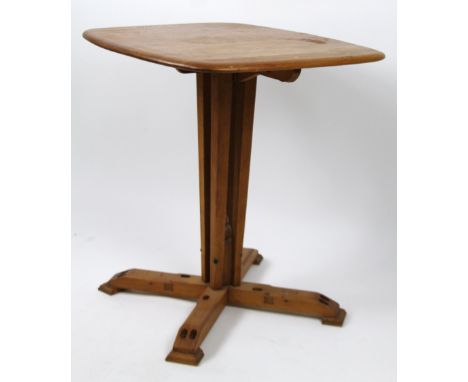 A mid 20thC Ercol light elm side table, with rounded top raised on a shaped support, terminating in compressed feet, 74cm H, 