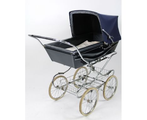 A mid 20thC vintage Silver Cross pram. in blue with chrome handles and shaped basket, beneath raised on two sized articulated