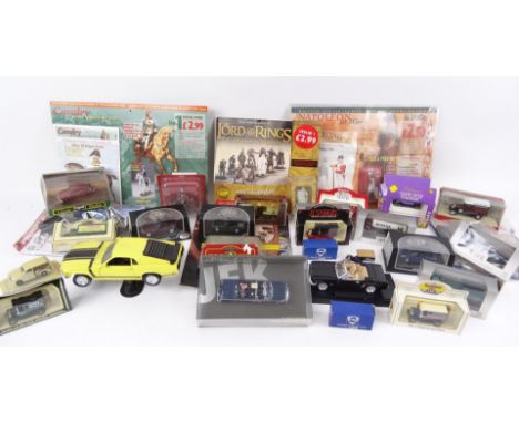 A pressed leather case, 26cm wide, containing a quantity of various die-cast vehicles, boxed, unboxed, etc., Lord of The Ring