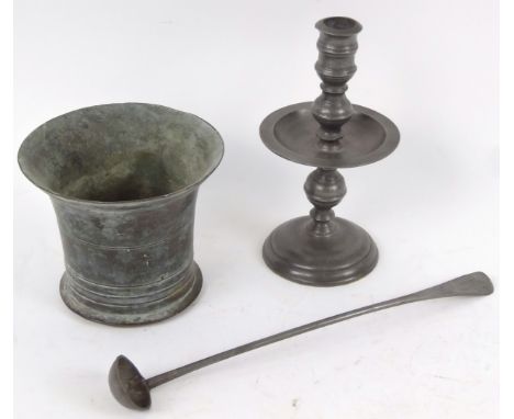 A late 18th/early 19thC mortar, pewter candlestick and pewter ladle, Old English pattern with cylinder bowl 31cm wide. (a qua