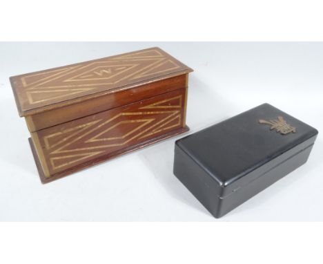 An early 20thC mahogany and partial inlaid jewellery casket, of rectangular outline, the hinged lid initialled W, with a remo