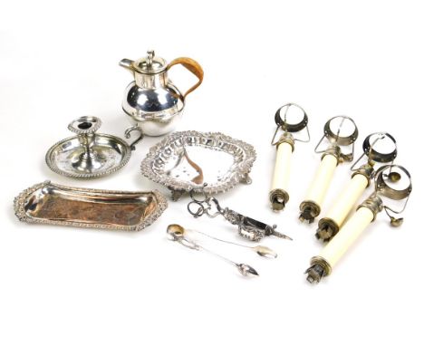 Silver plated wares, to include a chamber stick, Jersey type milk jug, a pair of candle scissors, sugar tongs and a square sa