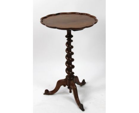 A 19thC tripod table, with entwined stem, on triple cabriole supports with a pie crust top, 74cm high, 50cm wide.