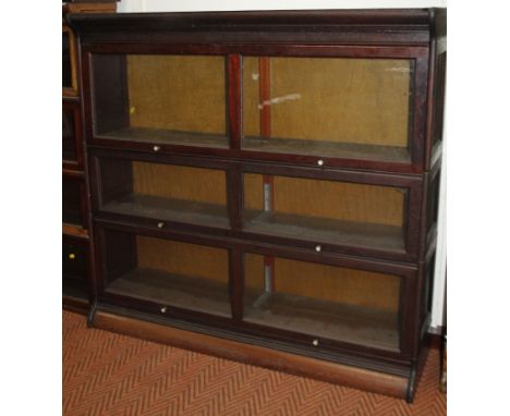 A late 19th/early 20thC Globe Wernicke type mahogany bookcase, with three double fronted glazed sliding doors on a plinth, 12