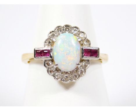 An 18ct gold diamond opal and ruby dress ring, in the Art Deco style, with central oval cut opal, surrounded by tiny diamonds