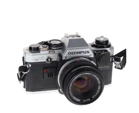 Olympus - OM10 SLR Film Camera with 50mm F/1.8 Lens and Manual Adapter.The camera winds and fires as should, all shutter spee