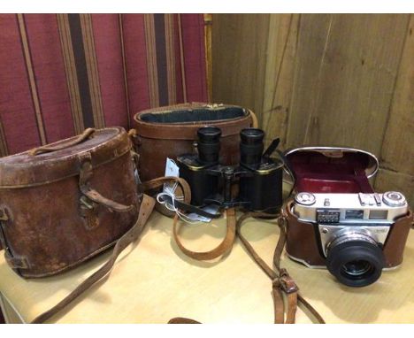 A vintage Kodak camera, the Retinette, with original travelling case, a pair of binoculars inscribed Taylor Hobson, 1941 with