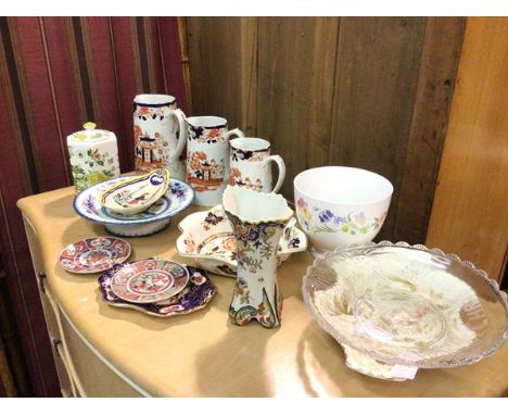 A mixed lot of china including a graduated set of Victorian Indiana pattern jugs, a Masons tea caddy, a Quimper spoon rest, C