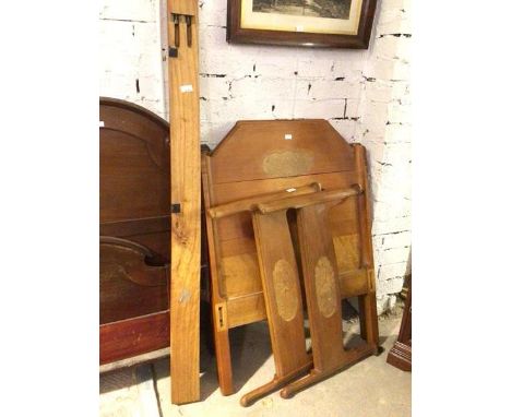 A pair of Whytock &amp; Reid single beds, the headboards and footboards with foliate relief carving to headboards, and birds 