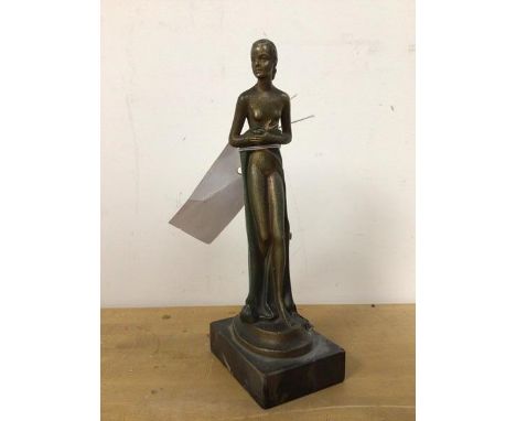 A 1920s/30s novelty lighter, in the form of a spelter female figure with a light striker to side, on marble base (20cm)