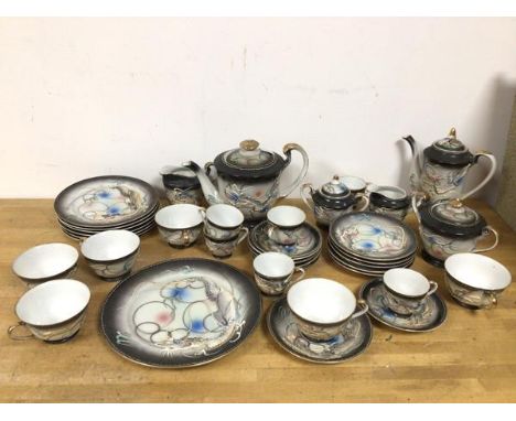 A 1920s Japanese part tea and coffee service with teapot (17cm), coffee pot, milk jug, sugar bowls, six teacups with saucers 