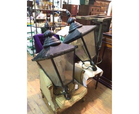 A pair of large black painted metal street lanterns, possibly Edinburgh gas lamps of tapering square form with ovoid tapering
