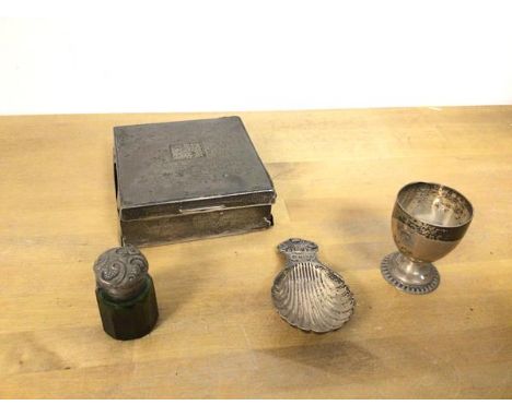 An Edwardian silver cigarette case (3.5cm x 9cm x 9cm), a small silver egg cup and caddy spoon and a scent bottle (a lot)