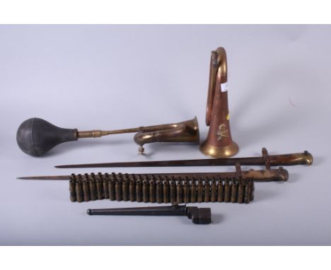 Two Franco Prussian war bayonets, a nail bayonet, a bugle with Italian Fascist relief, a cartridge belt and a brass car horn
