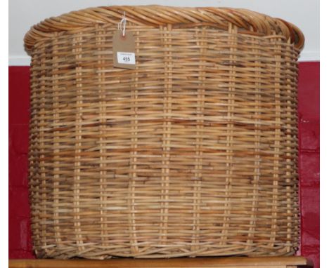 A wickerwork linen basket and a hamper
