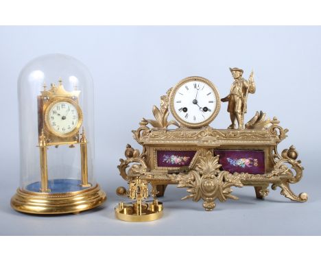 An early 20th century gilt metal mantel clock, with standing man and two painted porcelain panels, together with a late 20th 
