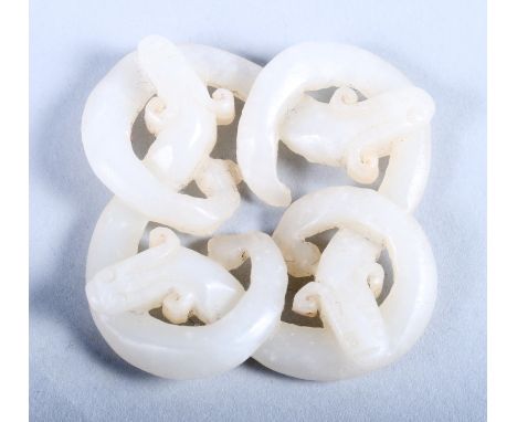 A 19th century? white jade brooch of four intertwining dragons, 1 3/4" wide