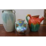 An early 20th century Boch Freres pottery jug, in orange, green and brown drip glaze, 7" high,