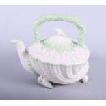 A Belleek porcelain (2nd period black mark) "Neptune" teapot, modelled in the form of a shell