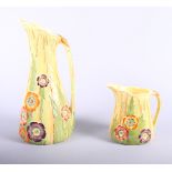 Two Carton Ware "Australian" pattern pottery jugs, 5 1/2" high and 11" high