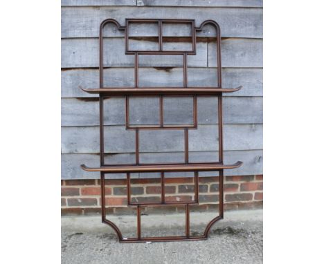 An Oswaldo Borsani 1950s walnut wall shelf in the Chinese taste, 52 1/2" high x 37" wide