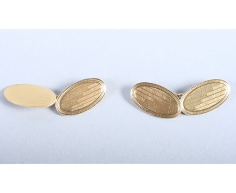 A pair of 18ct gold oval cufflinks with engine turned decoration, 10g