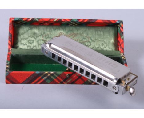 A 1950s "Blue Bird" harmonica, in box