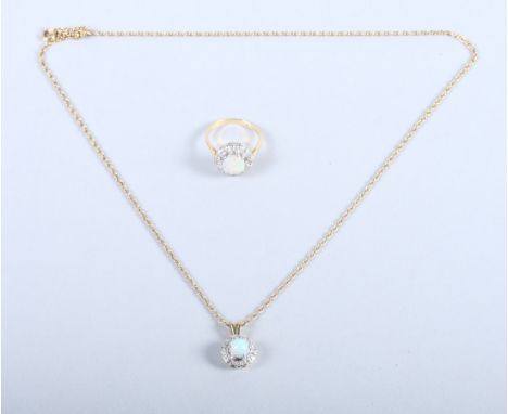 An 18ct gold, opal and diamond cluster ring with a matching design locket, on a gold trace link chain