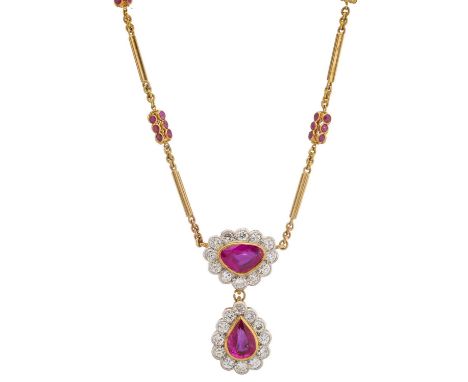 A gold ruby and circular-cut diamond pear-shape cluster drop pendant, with similarly-set surmount, suspended from a gold fanc