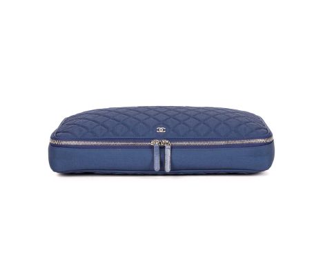 Chanel, a quilted laptop case, designed with a blue canvas exterior, silver-tone hardware to include maker's small front CC p