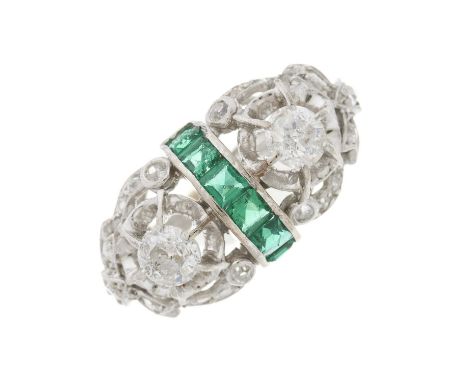 A mid 20th century vari-cut diamond openwork dress ring, with calibre-cut emerald central dome, estimated total diamond 1.40c