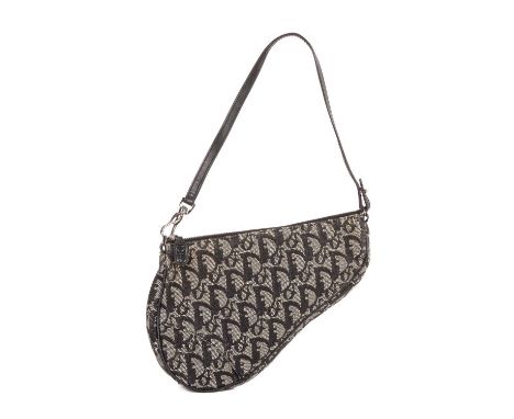 Christian Dior, a mini Diorissimo Saddle handbag, featuring the maker's monogram canvas exterior with smooth black leather tr