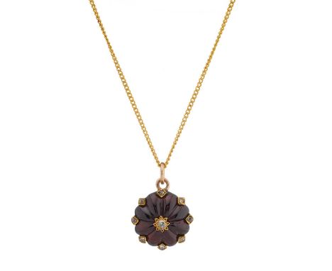 A late Victorian gold garnet cabochon and old-cut diamond cluster pendant, with rose-cut diamond spacers, suspended from a ye