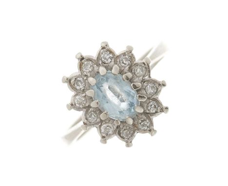 An 18ct gold aquamarine and old-cut diamond cluster ring, with tapered band, estimated total diamond weight 0.25ct, band stam