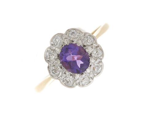 An early 20th century 18ct gold and platinum, amethyst and old-cut diamond cluster ring, estimated total diamond weight 0.30c