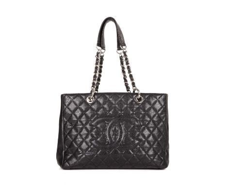 Chanel, a Grand Shopping Tote, crafted from grained black caviar leather with maker's classic diamond quilting and large embr