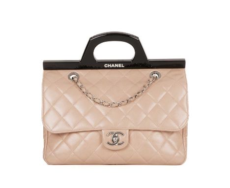 Chanel, a CC Delivery handbag, crafted from pale pink diamond quilted leather, featuring a unique black plexiglass top handle