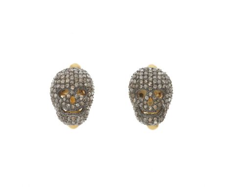 A pair of pave-set diamond cufflinks, each designed as a skull, with hinged reverse, length of cufflink face 1.5cm, 7.6gOvera